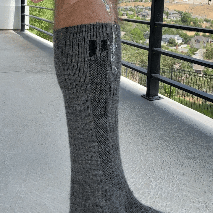 Water dripping down our compression socks to show moisture wickening. 